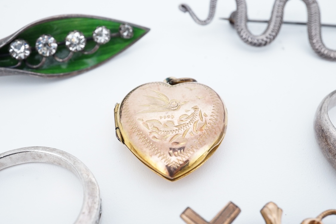 A small group of sterling, white metal and and other jewellery, including a charm bracelet, frog brooch, etc.